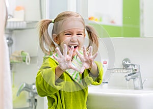 Child washing hands photo