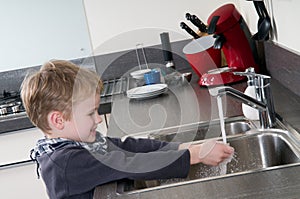 Child washing his hands