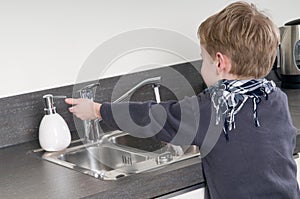 Child washing his hands