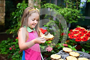 Child watching butterfly at tropical garden