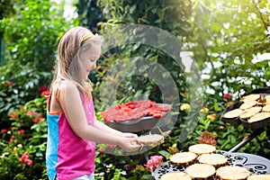 Child watching butterfly at tropical garden