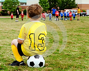 Child watching soccer game