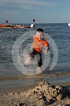 Child, water and fun. Beach fun.