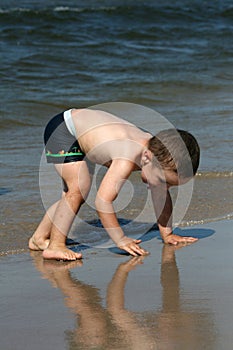 Child, water and fun. Beach fun.