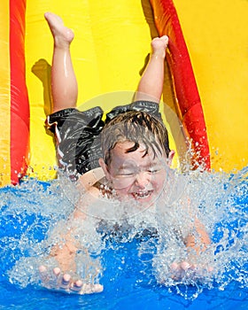 Child on water slide