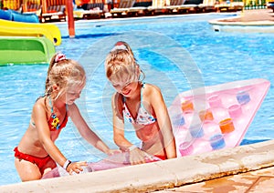 Child on water slide at aquapark.