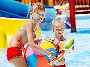 Child on water slide at aquapark.