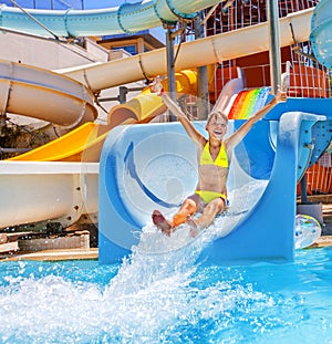 Child on water slide at aquapark