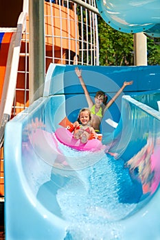 Child on water slide at aquapark