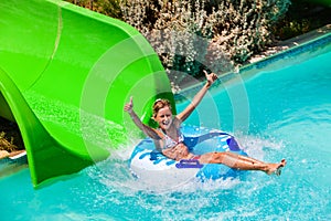 Child on water slide at aquapark