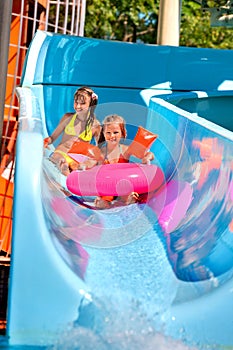 Child on water slide at aquapark