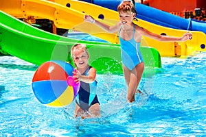 Child on water slide at aquapark