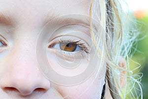 Child with waterdrops on wet face