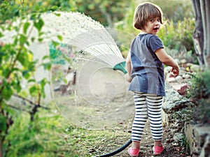 Child watering garden