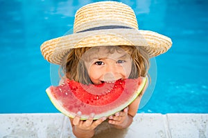 Child with watermelon in pool outdoor. Kid having fun in swimming pool. Kids summer vacation and healthy eating concept.