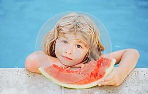 Child with watermelon in pool outdoor. Kid having fun in swimming pool. Kids summer vacation and healthy eating concept.