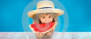 Child with watermelon in pool outdoor. Kid having fun in swimming pool. Kids summer vacation and healthy eating concept