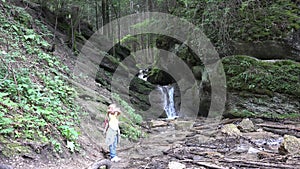 Child Waving Goodbye by Waterfall, Kid View in Mountains, Tourist Girl in Forest