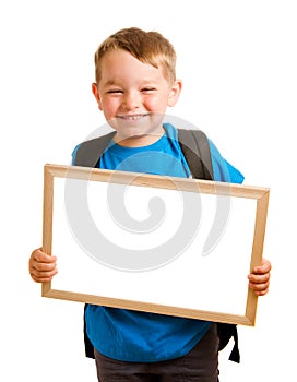 Child wearing backpack and holding blank sign