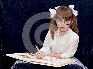 Child wearing black glasses