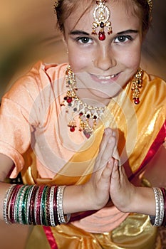 Child wearing bridal Indian clothing