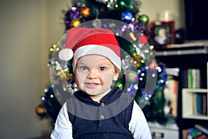A child wearing Santa Claus hat