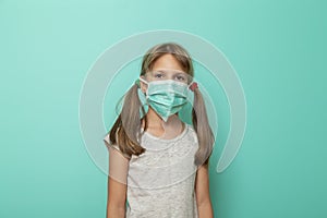 Child wearing syrgical mask as flu protection