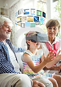 Child wearing VR Virtual Reality Headset with Interface and grandparents