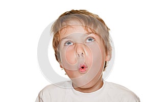 Child in white photography studio, amazement