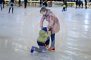 Child winter rink family mother,  ice-skating