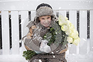 Child in the winter on the street