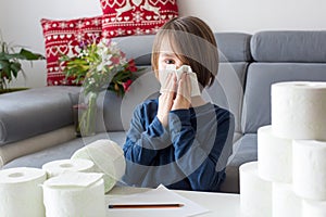 Child, wiping his nose with toilet paper at home, kid with running nose