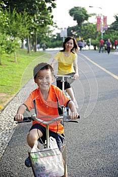 A child and a women cycling