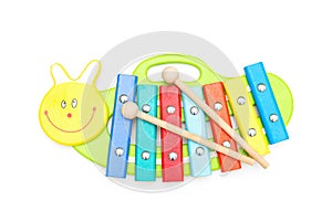 Child wooden xylophone andwooden sticks on a white background. E
