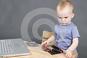 Child working at open hard drive
