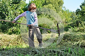 Child working with a rake