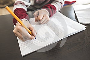 Child write in a notebook.