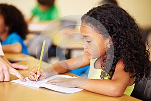 Child, writing and hand of teacher helping student at school for education, learning or development. Woman teaching girl