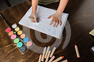 Child writing math exercise