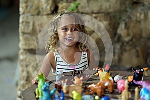 Child of 3-4 years old plays with toys in Chania