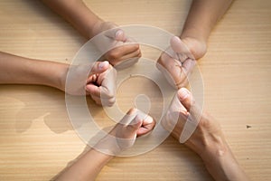 Childen asian people putting their hands together,teamwork with