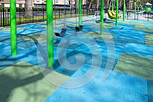 Childern`s colorful swing playground in urban city setting