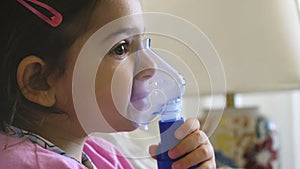 Childhood asthma inhaling mask illnesses little baby girl with flu id doing aerosol independently