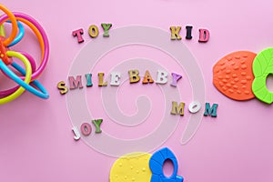 Childhood, care, hygiene, infants - The word baby teeth, toy, smile, mom, joy laid out of colored wooden letters on a