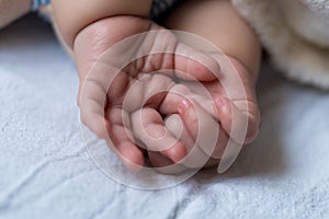 Childhood, care, motherhood, health concepts - Close up Little tiny hands palms of peace calm infant toddler baby girl