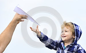 Childhood. Child son playing with paper airplane. Carefree. Freedom to Dream - Joyful Boy Playing With Paper Airplane.