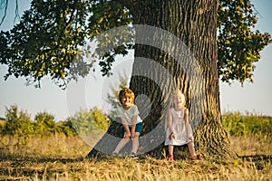 Childhood on countryside. Happy little farmers having fun on field. Ecology concept child. Eco life. Springtime on the