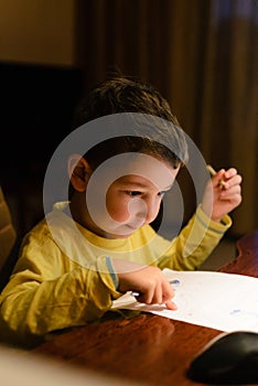 Childhood, cute boy drawing art at home. Happy child creativity