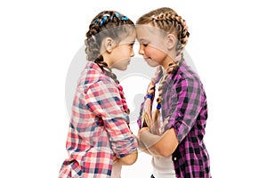 Childhood friends. Little friends isolated on white. Small friends wear long plait hair. Beauty look of adorable girls