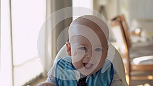 Childhood, Happiness, family, Motherhood. Cheerful happy smiling baby Close up face. Emotions of newborn boy. child in a